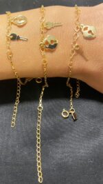 PULSEIRA COM BERLOQUES - BANHO EM OURO AMARELO - Imagem 2